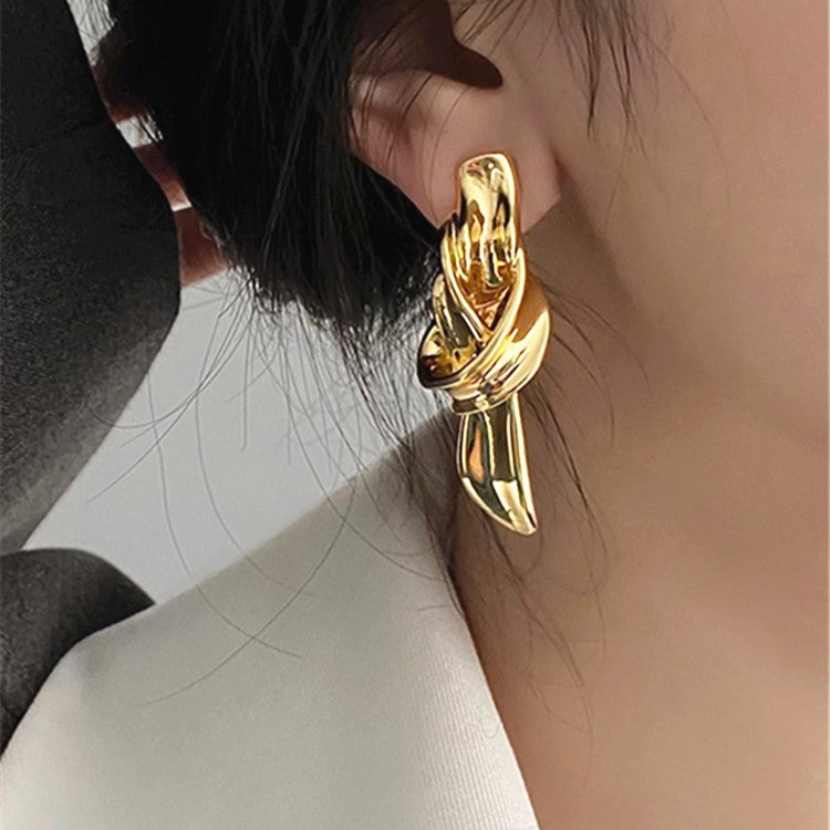 Orecchini scultorei a trama dorata - Vittoria