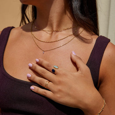 Anello in lega dorata con doppia pietra ovale - Nerida